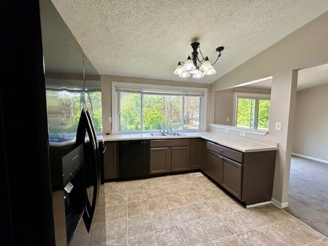 Building Photo - Welcome Home to This Beautifully Maintained Tri-Level Gem!