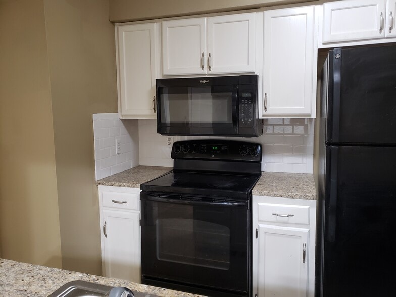 Microwave, dishwasher, oven and refrigerator included. New granite with subway tile backsplashes - 1218 Sharlo Ave