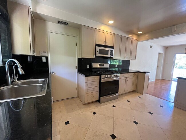 Building Photo - A hidden gem with tree-top view. Tranquil and private. Light and airy