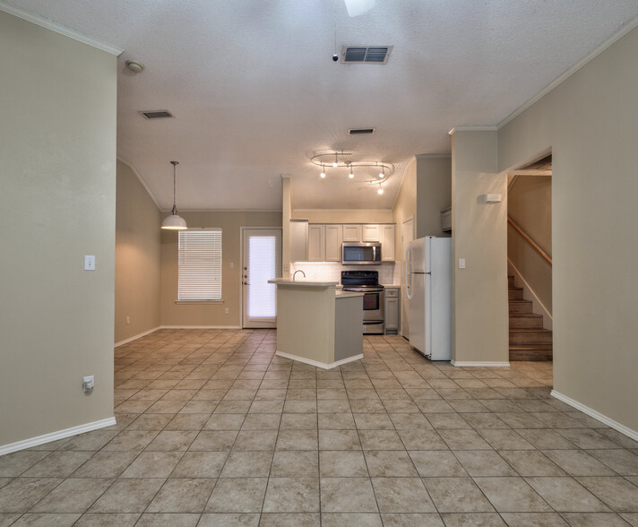 View of Dining and Kitchen from Living Area - 7556 Arbor Hill Dr