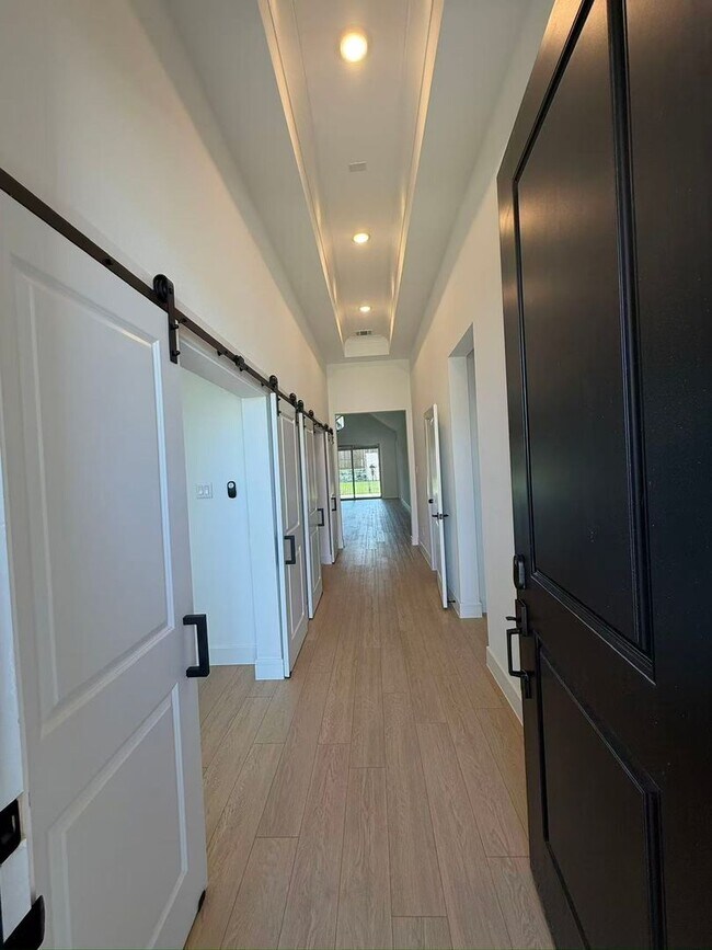 Building Photo - Move-in ready and like-new! Washer, dryer, and refrigerator Included.