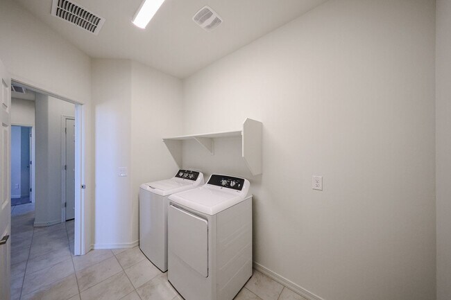 Building Photo - New 4 Bedroom + Den Home in Asante Community