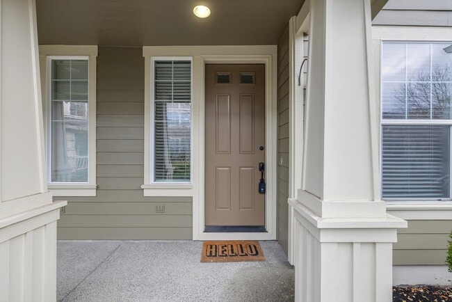 Building Photo - Lovely and bright townhouse with a hard wood flooring throughout, a 2 car garage, AC & more!