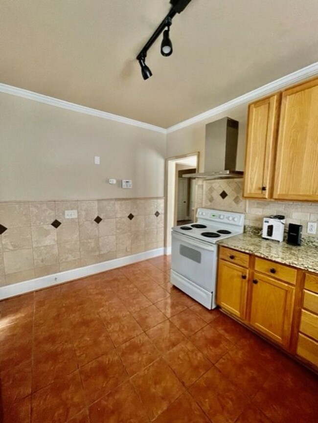 Building Photo - Introducing WesleyHeights401, a charming 3...