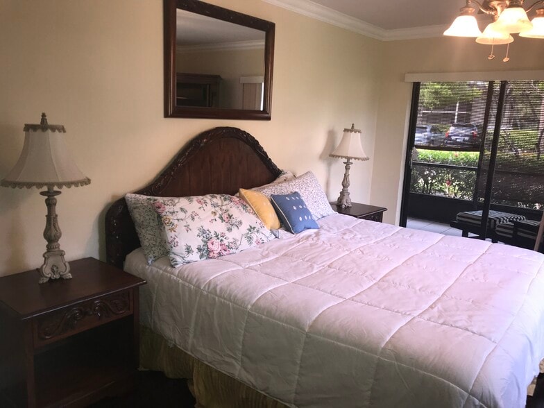 master bedroom with kind bed set - 135 Deer Creek Blvd