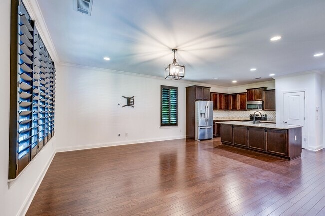 Building Photo - Welcome to this charming end unit townhome