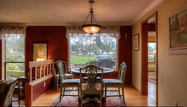 Building Photo - 4bd/3ba HUGE Home w/Hardwood Floors, Russian Fireplace, 2-Car Garage & Fenced Back Yard!