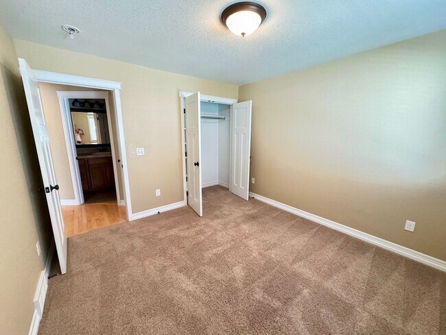 Building Photo - 4 BEDROOM, 3 BATHROOM TWINHOME WITH 2 CAR ATTACHED GARAGE IN NORTH CHEYENNE