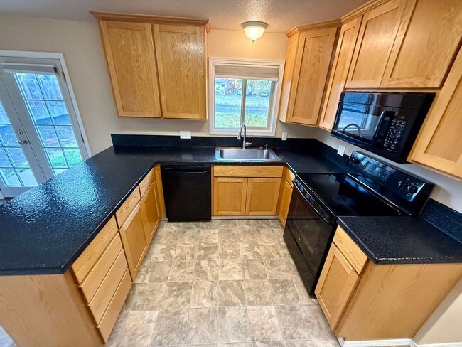 Building Photo - **For Rent: Spacious 4-Bedroom Home with 2...