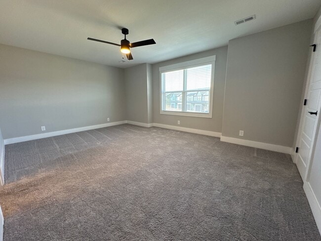 Building Photo - “Stylish 3BR End-Unit | Open Concept | Quartz Kitchen | Garage + Deck
