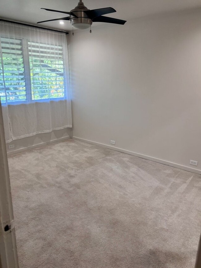 Building Photo - Available Now | 2 Bedroom, 2 Bathroom Townhouse with 1 Assigned Parking Stall at Tropic Gardens 1