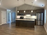 Building Photo - Charge up your new home! Pre-leasing for January 14th Move In—garages come EV-ready. Hurry, homes...