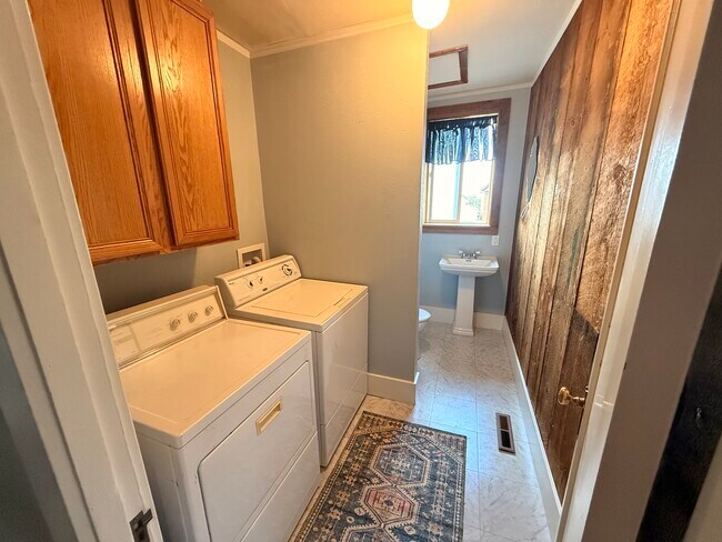 Laundry room with full-size washer and dryer - 215 N Emmett Ave