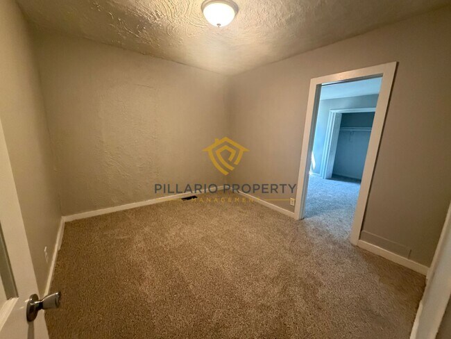 Building Photo - Charming 3-Bedroom Stone Bungalow with 2-Car Detached Garage & Fenced Yard, Available NOW!