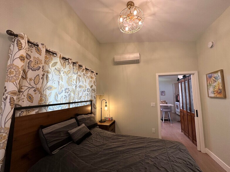 Bedroom #1 with ceiling fan and wall-mounted Euro-style heater/AC - 1490 Ash St