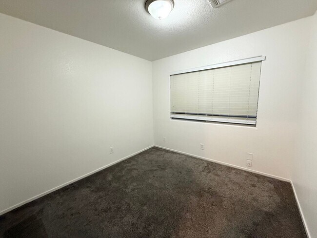 Building Photo - $500 OFF 1ST MONTHS RENT Updated 3-Bedroom Townhome in Gated Community with Pool Access