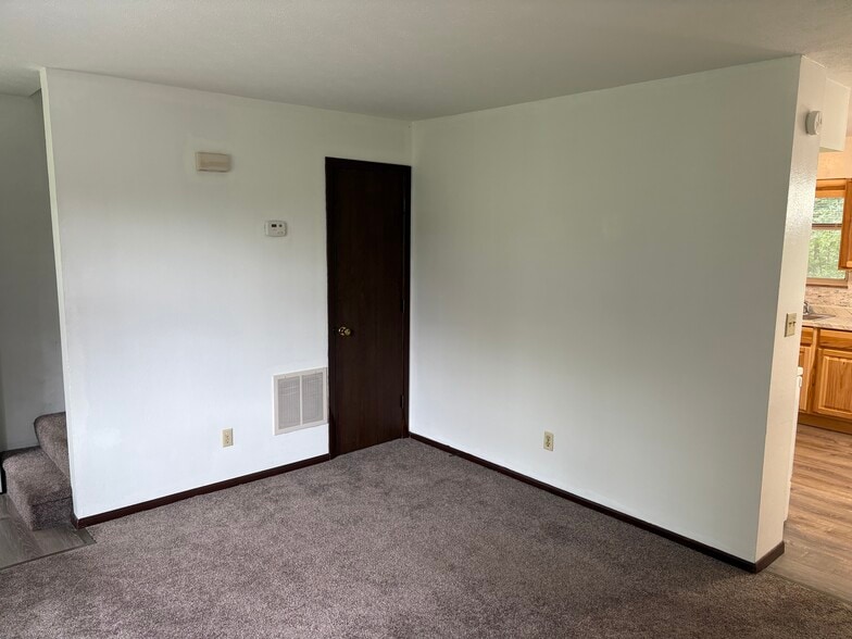 COAT CLOSET IN LIVING ROOM - 715 Pearl Dr