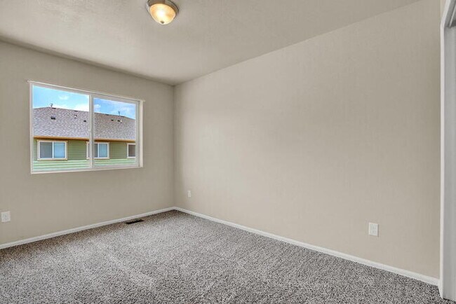Building Photo - Modern Townhome with Central A/C, 2-Car Ga...