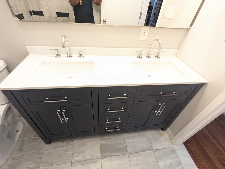 Refreshed bathroom with double vanity - 2024 N Calvert St