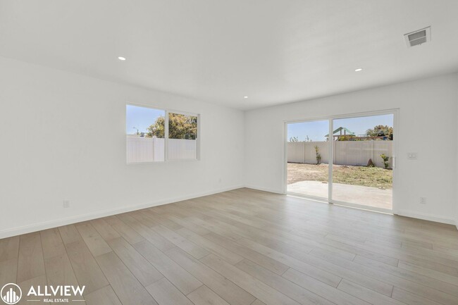 Building Photo - Fully Renovated 4-Bedroom Home with Firepl...