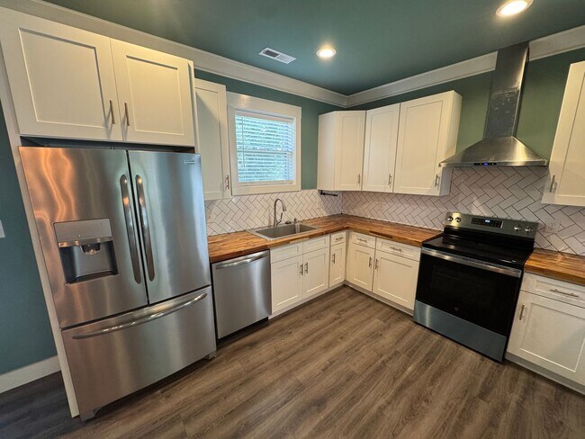 Building Photo - Modern Bungalow Charm: Designer Finishes & Expansive Backyard Living!