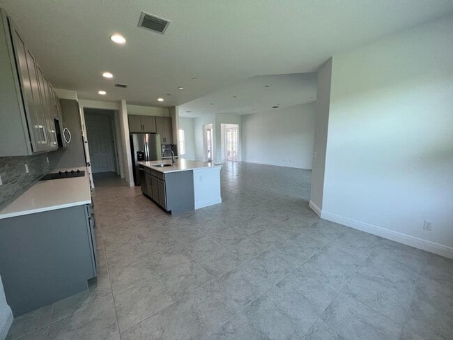 Building Photo - This Charming Brand-New Home is a 4/3 with...