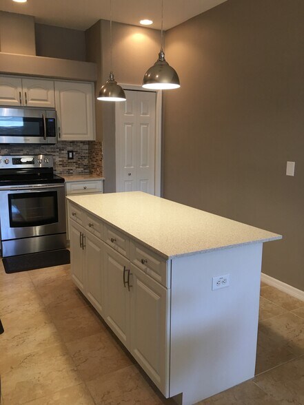 Kitchen island with pendant lighting - 3103 W Napoleon Ave
