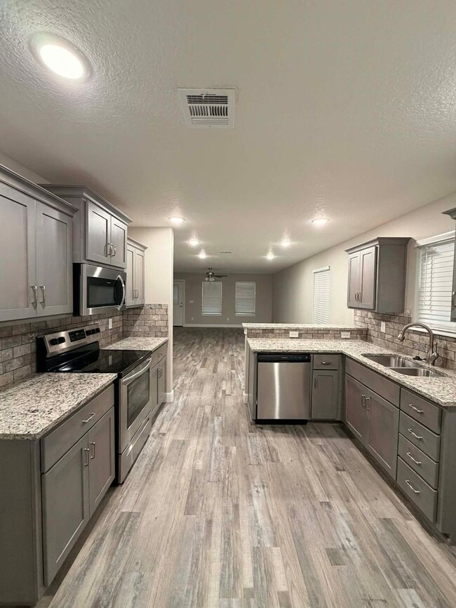 Building Photo - New build, 3 bed/2 bath, stainless steel appliances, two car garage, fenced in back yard!!!!