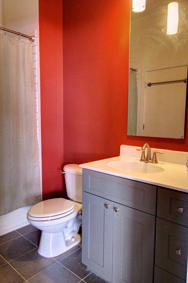 Building Photo - Downtown Durham 1bd/1ba Corner-Unit Condo with On-Site Personal 1-Car Garage!