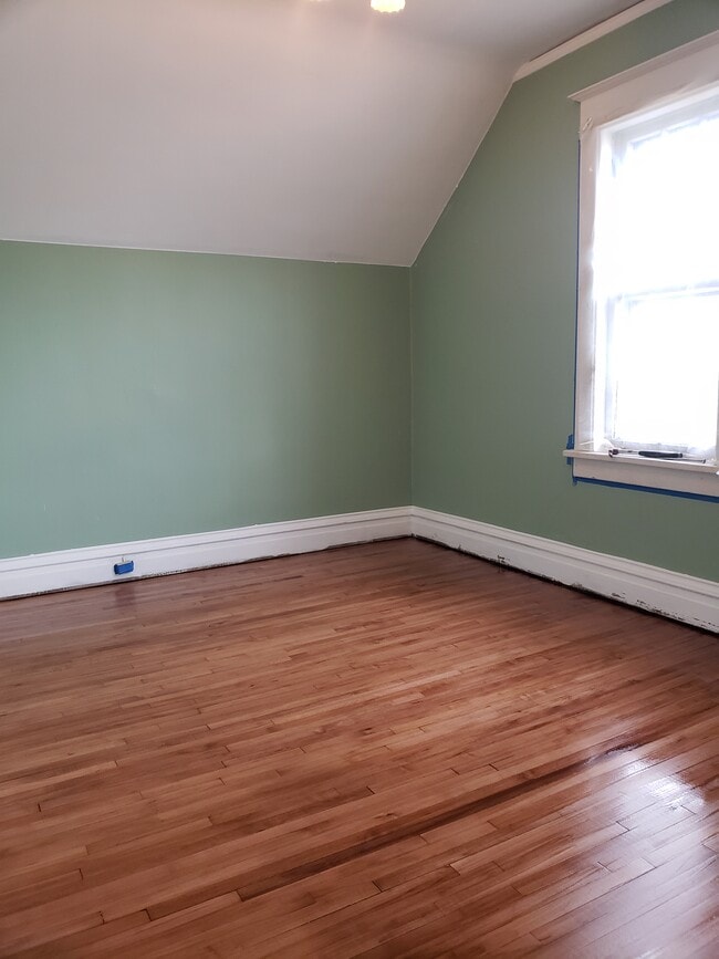 Bedroom #3: Floors completely refinished and fresh paint. - 522 N 42nd Ave W