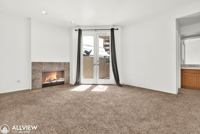 Building Photo - Spacious Coastal Condo with Rooftop Ocean ...