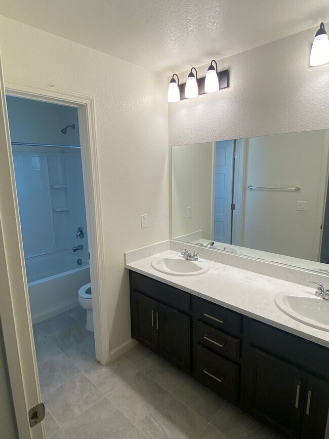 Building Photo - Almost new! Gated 4 Bdrm, 2.5 Bath Solar Home