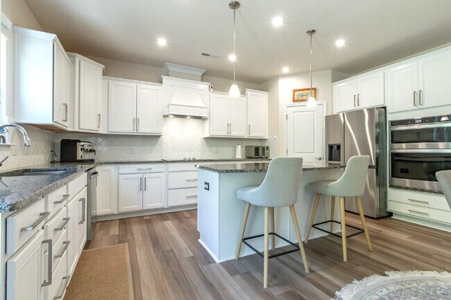 Building Photo - "Discover Spacious Living: 5-Bedroom Craftsman Home in Gated and Amenity-Rich Bretagne with Top-R...
