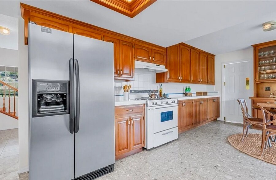 Large refrigerator and electric stove (note: new electric stove not pictured). - 221 Appy Way