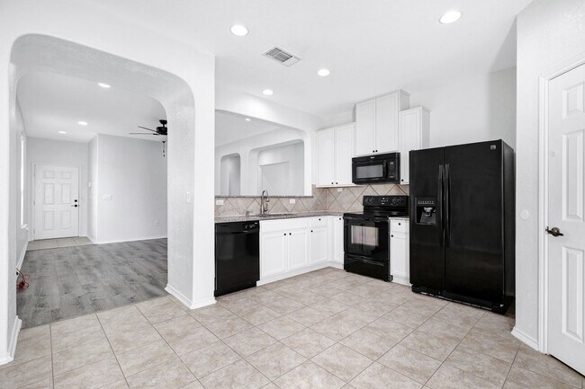 Building Photo - ***MOVE-IN SPECIAL: ONE WEEK FREE***Luxurious Move-In Ready Home with Versatile Living Spaces