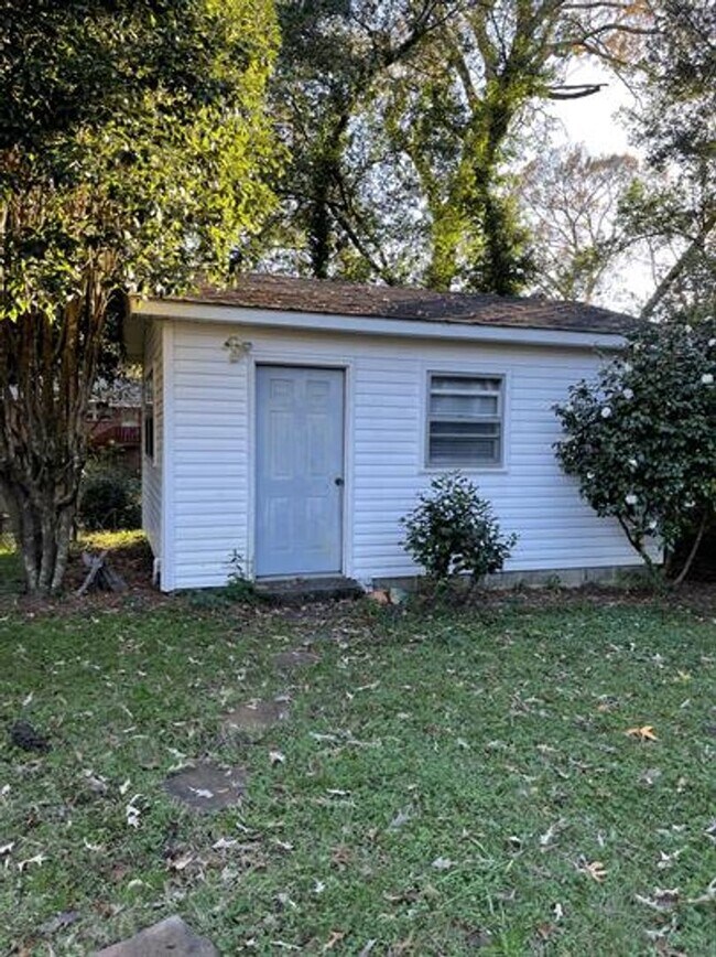 Building Photo - 2 Living Spaces and Carport