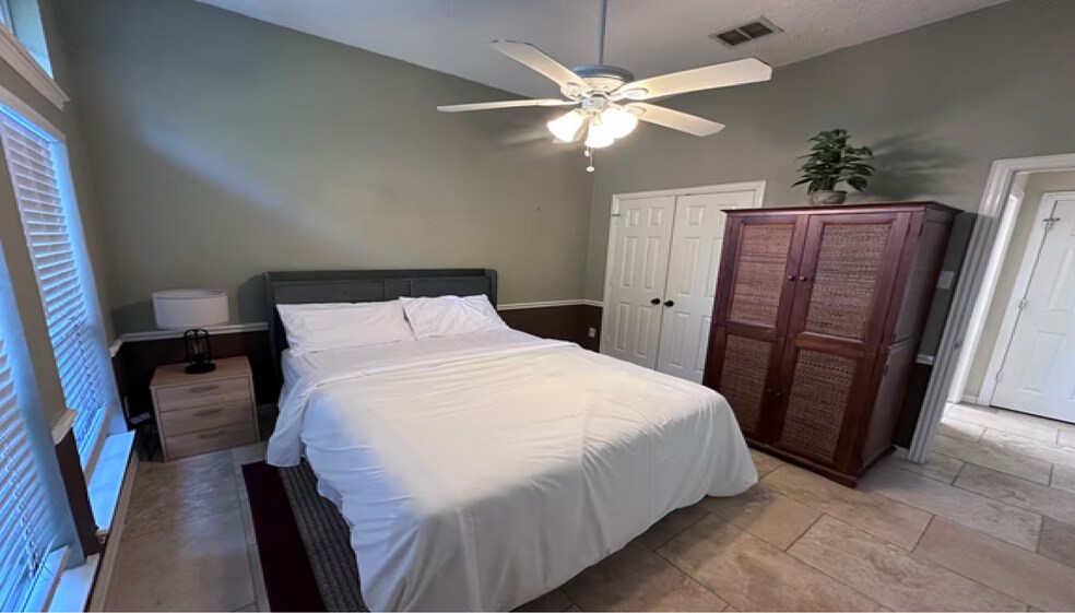 Elegant first-floor queen suite with a private full bath, graceful French doors - 10913 Alexandria Dr