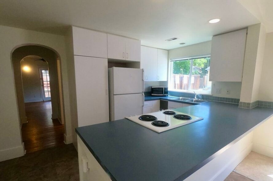 Ample kitchen storage. New water heater. - 920 University Ave
