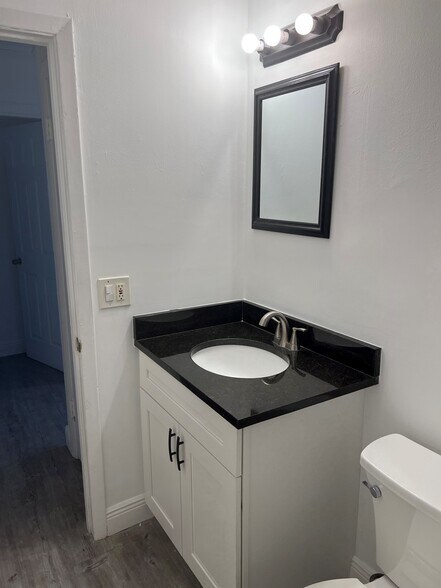 Bathroom w/ granite vanity - 2405 NE Rustic Plz