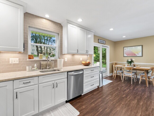 Building Photo - Beautifully Updated Home with Finished Lower Level, Fenced Yard & Exceptional Outdoor Living