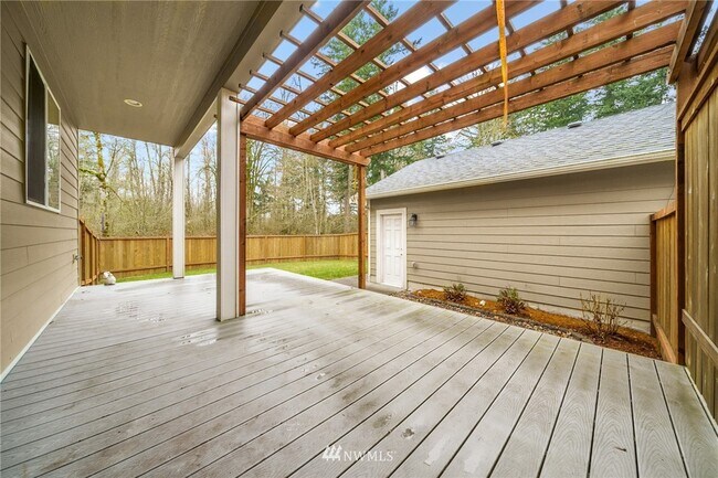 Backyard with deck. - 16439 77th Avenue Ct E
