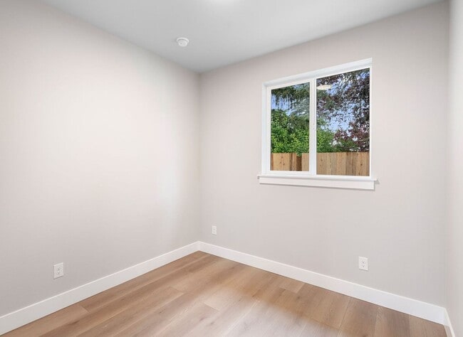 Building Photo - Brand-New Detached 2 Bedroom Home with Private Fenced Yard and Designer Finishes