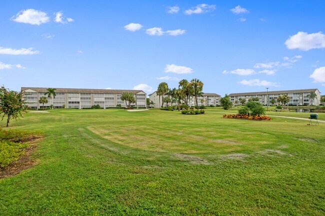 Building Photo - first-floor unit featuring a 2 bedroom, 2 bath fully furnished