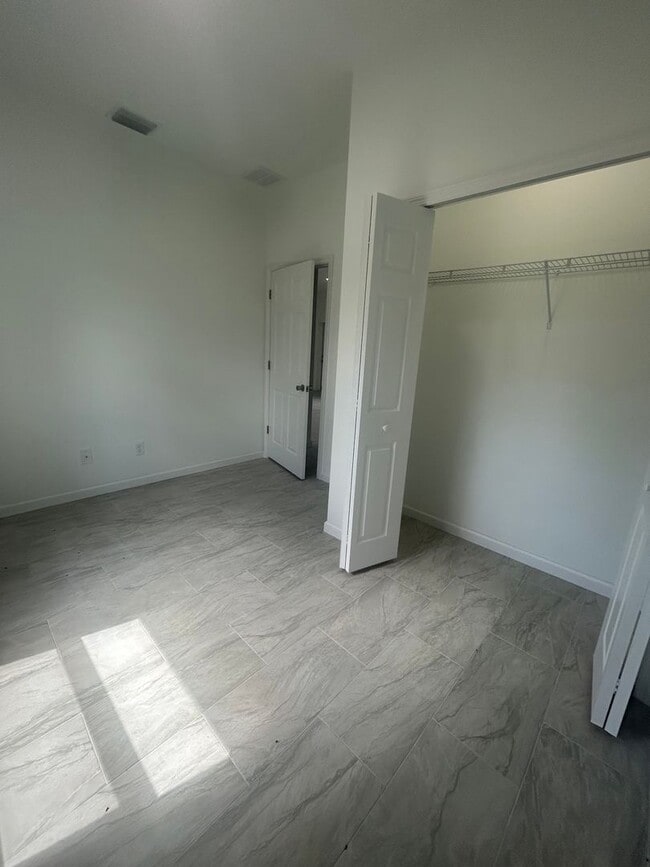 Building Photo - JUST BUILT! Modern 3 Bed / 2 Bath Home with Garage in Serene Lake Placid