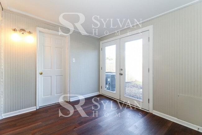 Building Photo - Venture outside to the expansive backyard,...