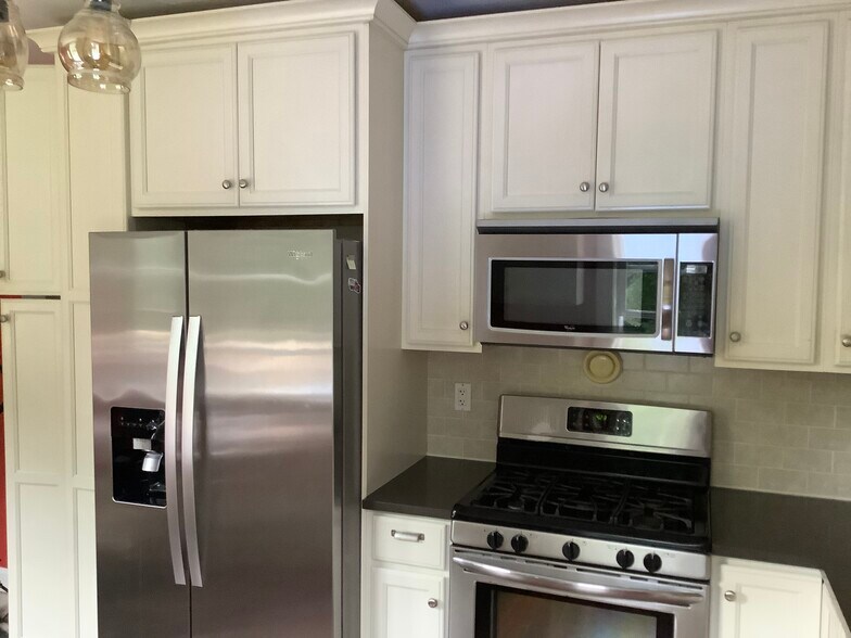 Stainless steel appliances and five burner gas stove. - 9 Jay St