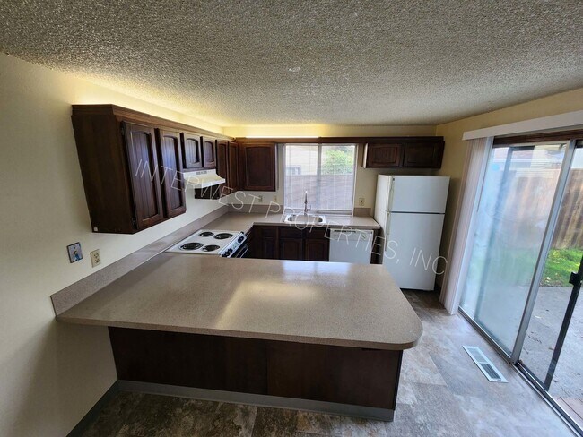 Building Photo - *1/2 OFF 1ST MONTH'S RENT PROMO* 3 Bd that Features Master on the Main with Fenced Yard, 2 Car Ga...