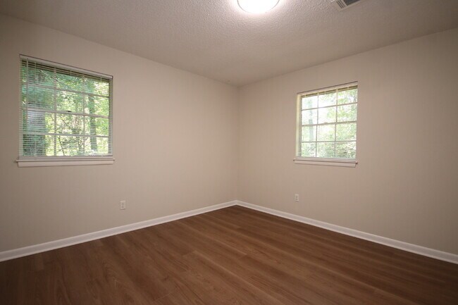 Building Photo - Fully Renovated 3BR/2BA Molino Home on a Spacious Lot Featuring Multiple Living Areas, Sunroom & ...