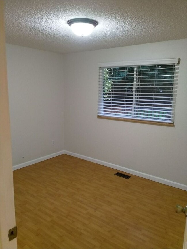 Building Photo - Charming updated 3 bed 1 bath ranch style home with double car garage and large fenced back yard.