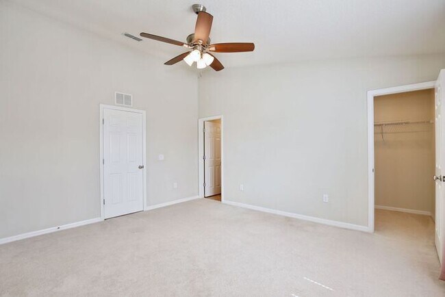 Building Photo - Immaculate Townhome · Dual En-Suite Bedrooms + Flex Loft · Cable & Internet Included · 3.5 Miles ...